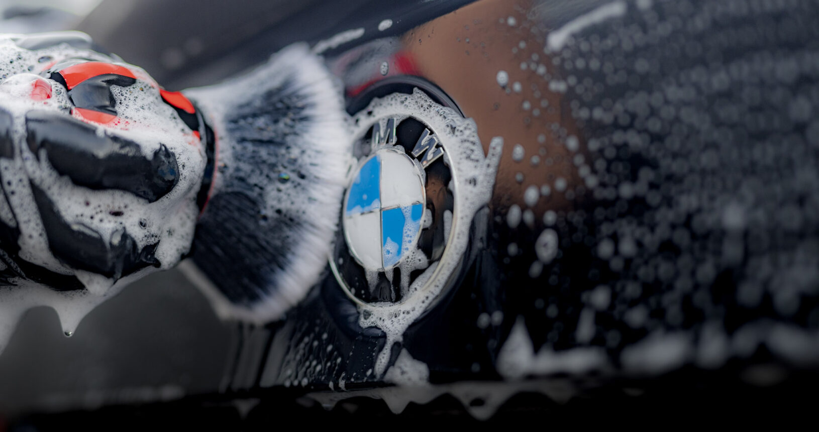Exquisite Mobile Detailing Using A Fine Brush On BMW Badge